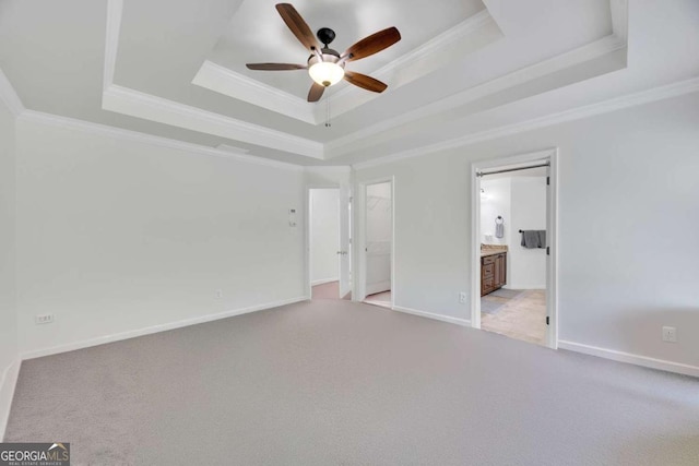 4206 Moccasin Trl, Woodstock, GA 30189 - unfurnished bedroom featuring a raised ceiling, ornamental molding, carpet flooring, ensuite bath, and a ceiling fan