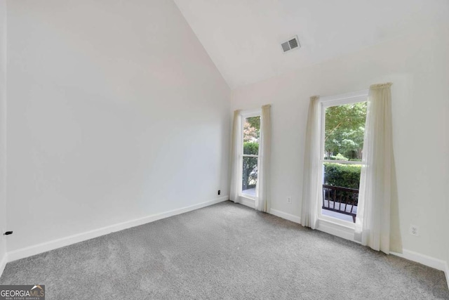 4206 Moccasin Trl, Woodstock, GA 30189 - empty room featuring carpet and vaulted ceiling