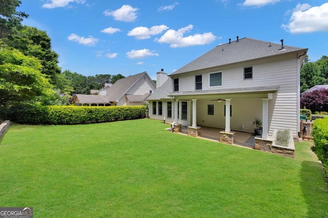 4206 Moccasin Trl, Woodstock, GA 30189 - back of property with a patio area and ceiling fan