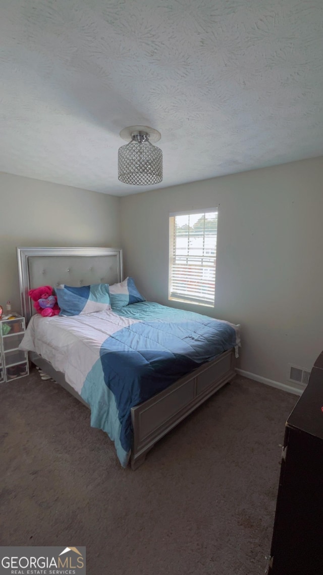 501 Carlton Rd # 3B, Palmetto, GA 30268 - bedroom featuring carpet flooring and a textured ceiling