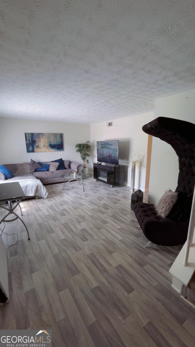 501 Carlton Rd # 3B, Palmetto, GA 30268 - living area with wood finished floors and a textured ceiling