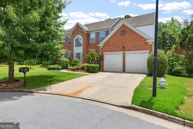 5003 Pacific Dunes Dr, Suwanee, GA 30024 - view of front of house featuring concrete driveway, a front yard, and brick siding