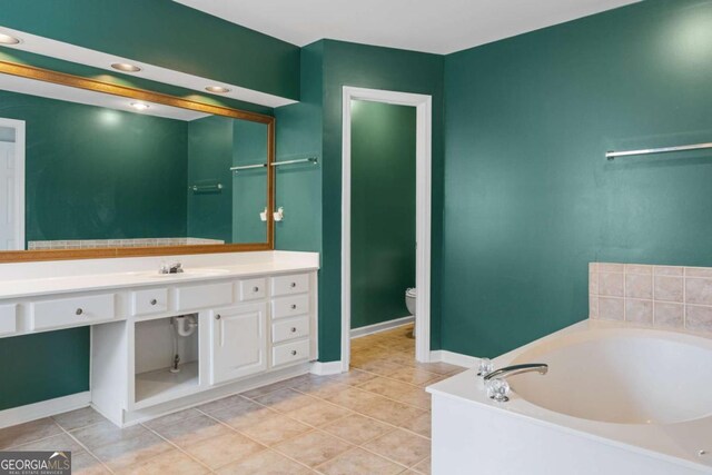 5003 Pacific Dunes Dr, Suwanee, GA 30024 - bathroom featuring a bath, vanity, tile patterned floors, and recessed lighting