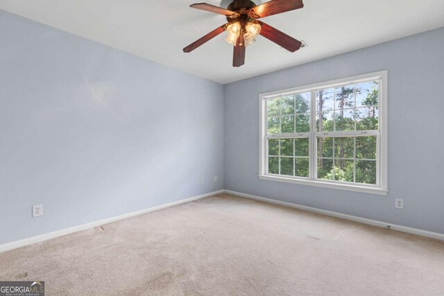5003 Pacific Dunes Dr, Suwanee, GA 30024 - carpeted spare room featuring baseboards and a ceiling fan