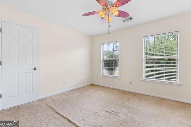 5003 Pacific Dunes Dr, Suwanee, GA 30024 - empty room with carpet and a ceiling fan