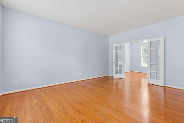 5003 Pacific Dunes Dr, Suwanee, GA 30024 - unfurnished room with french doors and light wood-type flooring
