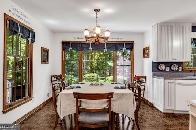 3754 Wyntuck Cir NW, Kennesaw, GA 30152 - dining space featuring brick patterned flooring and a chandelier
