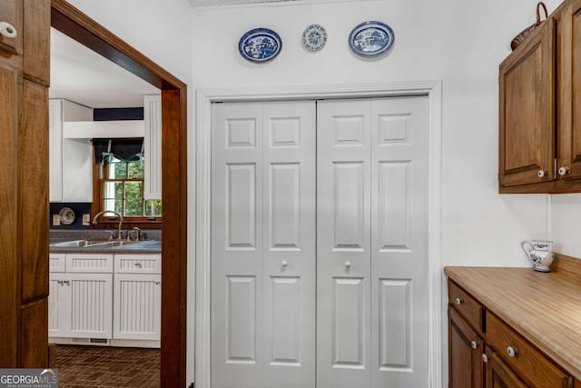 3754 Wyntuck Cir NW, Kennesaw, GA 30152 - kitchen featuring brown cabinets and brick patterned flooring