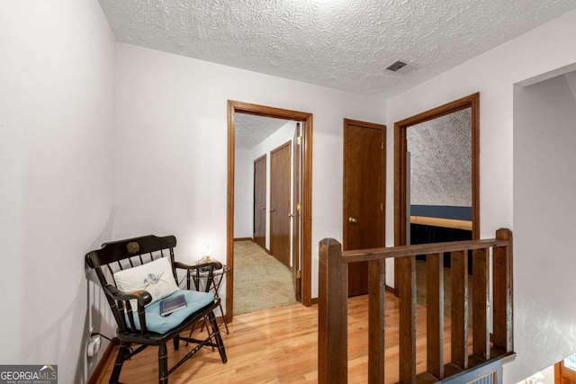 3754 Wyntuck Cir NW, Kennesaw, GA 30152 - hall featuring light wood-style flooring, an upstairs landing, and a textured ceiling