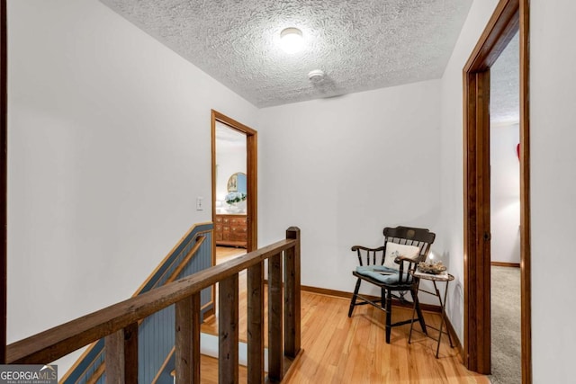 3754 Wyntuck Cir NW, Kennesaw, GA 30152 - corridor with an upstairs landing, a textured ceiling, and light wood finished floors