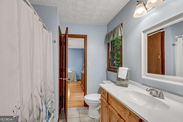 3754 Wyntuck Cir NW, Kennesaw, GA 30152 - full bath featuring vanity, tile patterned flooring, a textured ceiling, and curtained shower