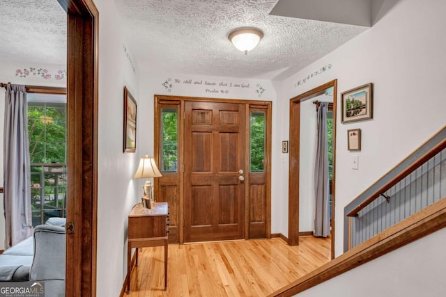 3754 Wyntuck Cir NW, Kennesaw, GA 30152 - entrance foyer featuring a textured ceiling and light wood finished floors