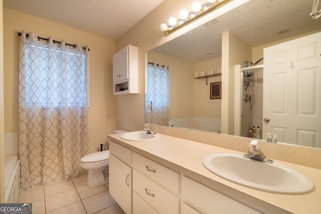 3030 Thornberry Cir, Phenix City, AL 36867 - bathroom with double vanity, tile patterned flooring, shower / tub combo, and a textured ceiling