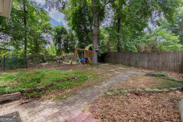 3030 Thornberry Cir, Phenix City, AL 36867 - fenced backyard with a playground