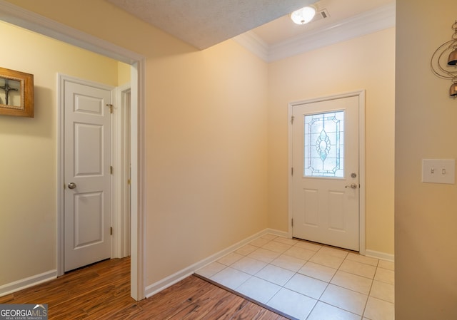 3030 Thornberry Cir, Phenix City, AL 36867 - foyer entrance featuring ornamental molding and light wood finished floors