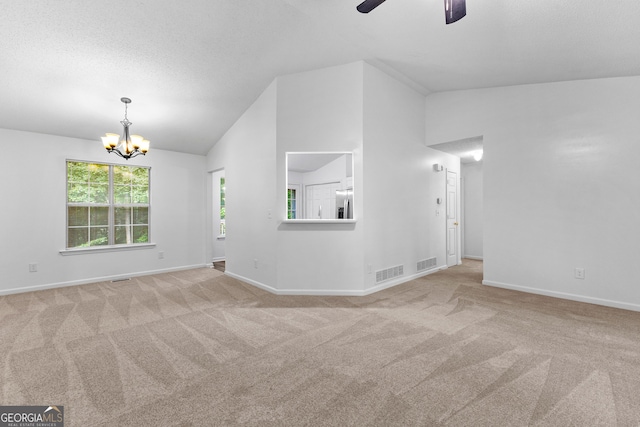 165 Lost Lake Trl, Villa Rica, GA 30180 - carpeted empty room with lofted ceiling, a chandelier, and a ceiling fan