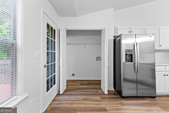 165 Lost Lake Trl, Villa Rica, GA 30180 - kitchen featuring stainless steel refrigerator with ice dispenser, light wood-style floors, white cabinetry, and vaulted ceiling