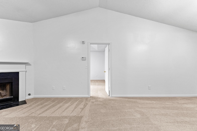 165 Lost Lake Trl, Villa Rica, GA 30180 - unfurnished living room featuring carpet flooring, a fireplace, and vaulted ceiling