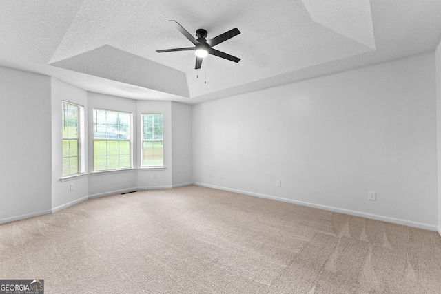 165 Lost Lake Trl, Villa Rica, GA 30180 - carpeted empty room featuring a tray ceiling, a ceiling fan, and a textured ceiling