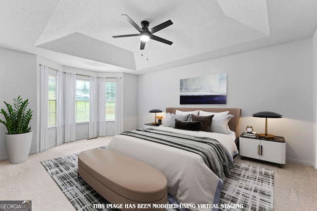 165 Lost Lake Trl, Villa Rica, GA 30180 - carpeted bedroom featuring a tray ceiling, a textured ceiling, and ceiling fan