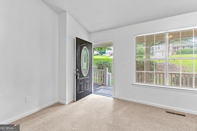 165 Lost Lake Trl, Villa Rica, GA 30180 - carpeted entryway featuring baseboards and lofted ceiling