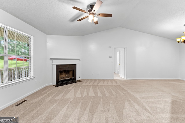 165 Lost Lake Trl, Villa Rica, GA 30180 - unfurnished living room featuring carpet, ceiling fan, a fireplace with flush hearth, a chandelier, and lofted ceiling