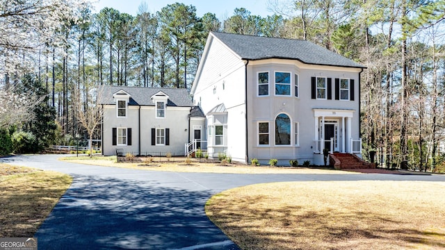 55 Summerhill Pl, Newnan, GA 30263 - french country home featuring stucco siding and curved driveway