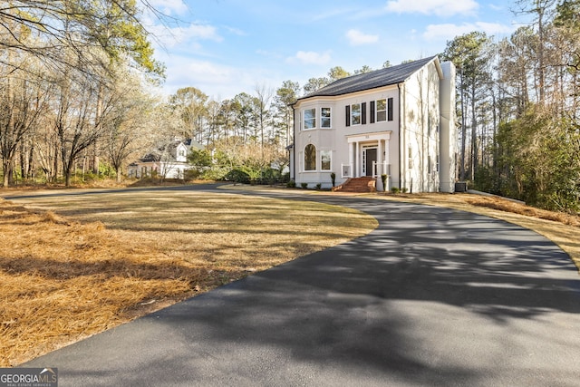 55 Summerhill Pl, Newnan, GA 30263 - view of front of property featuring a chimney, asphalt driveway, and a front lawn