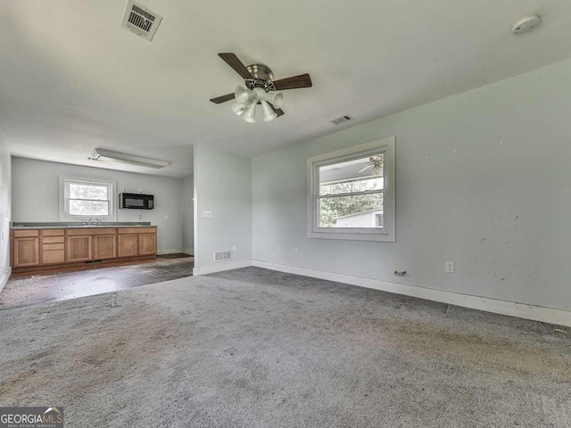 14367 Fincher Rd, Canton, GA 30114 - unfurnished living room with light carpet and ceiling fan