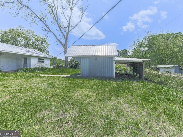 14367 Fincher Rd, Canton, GA 30114 - view of green lawn with an outbuilding