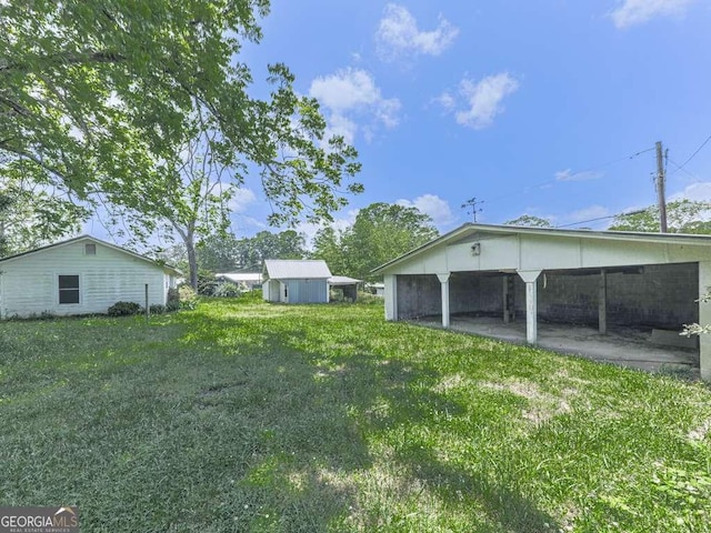 14367 Fincher Rd, Canton, GA 30114 - view of yard featuring a carport and an outbuilding