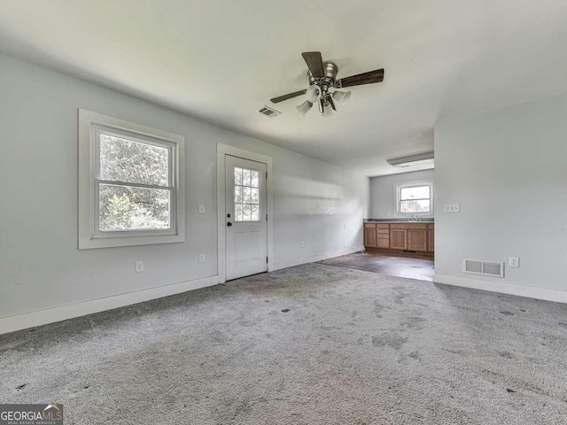 14367 Fincher Rd, Canton, GA 30114 - unfurnished living room featuring plenty of natural light, ceiling fan, and carpet floors