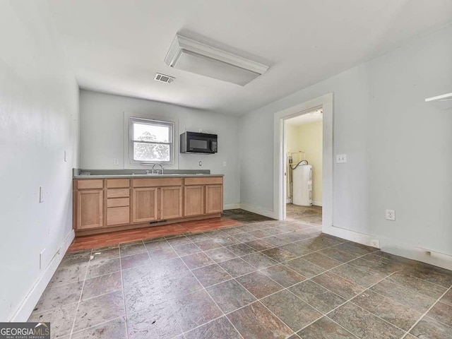 14367 Fincher Rd, Canton, GA 30114 - kitchen featuring black microwave and dark stone finish floors