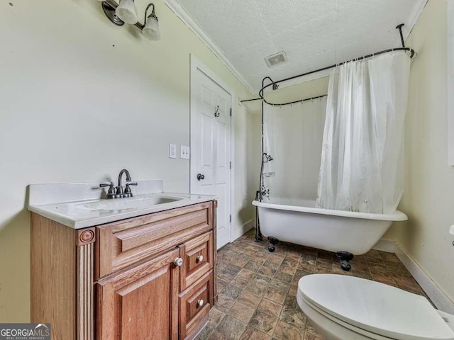 14367 Fincher Rd, Canton, GA 30114 - bathroom featuring ornamental molding, vanity, a textured ceiling, stone finish floors, and a combined bath / shower with freestanding tub