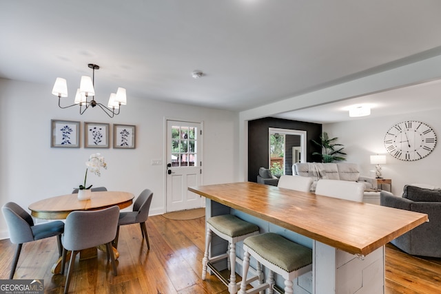 7250 Hunters Branch Dr, Atlanta, GA 30328 - dining space with a chandelier and wood-type flooring