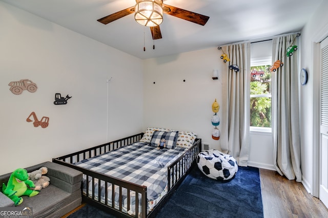 7250 Hunters Branch Dr, Atlanta, GA 30328 - bedroom with wood finished floors and ceiling fan