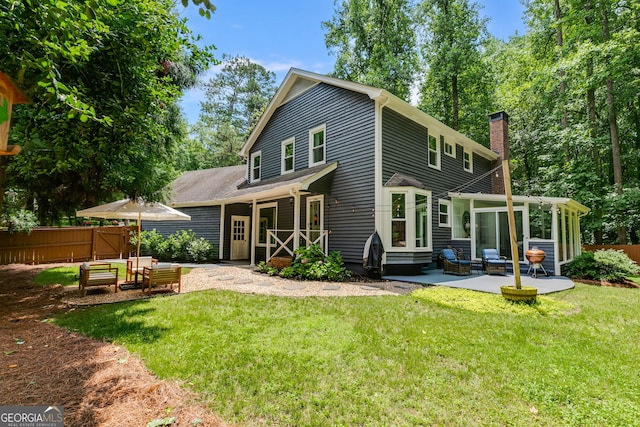 7250 Hunters Branch Dr, Atlanta, GA 30328 - rear view of house with a chimney, a patio area, and entry steps