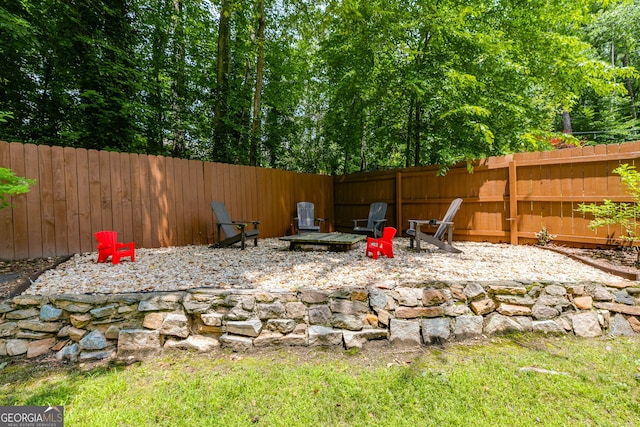 7250 Hunters Branch Dr, Atlanta, GA 30328 - fenced backyard featuring an outdoor fire pit