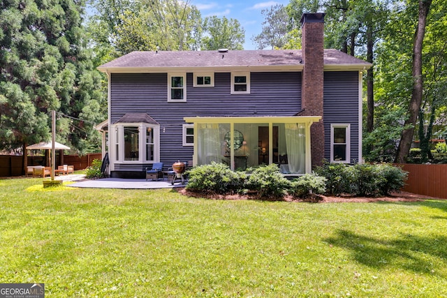 7250 Hunters Branch Dr, Atlanta, GA 30328 - rear view of house with a chimney, a patio, and a shingled roof