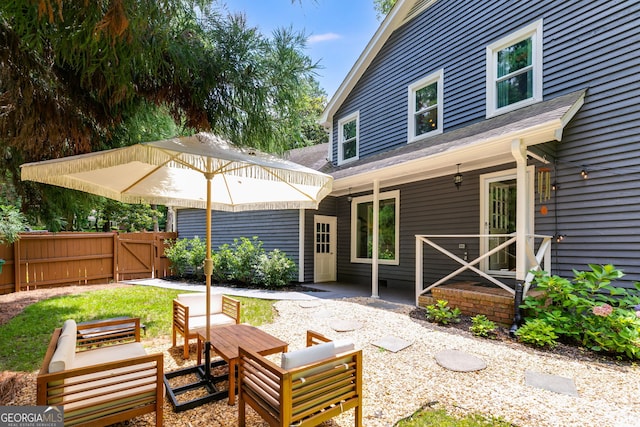 7250 Hunters Branch Dr, Atlanta, GA 30328 - rear view of property featuring a gate and a shingled roof