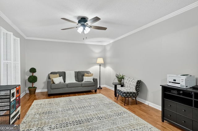 1505 Misty Valley Dr, Chatsworth, GA 30705 - living room featuring a ceiling fan, wood finished floors, ornamental molding, and a textured ceiling