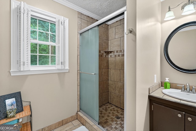 1505 Misty Valley Dr, Chatsworth, GA 30705 - bathroom featuring ornamental molding, a stall shower, vanity, a textured ceiling, and tile patterned floors