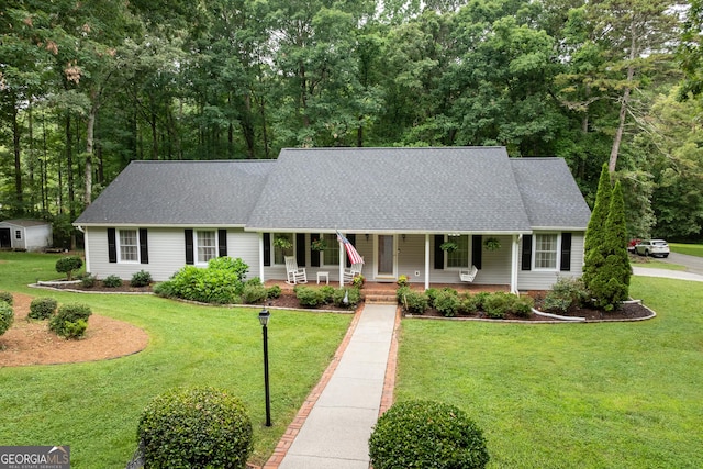 1505 Misty Valley Dr, Chatsworth, GA 30705 - view of front of house with a porch, a front yard, and a shingled roof