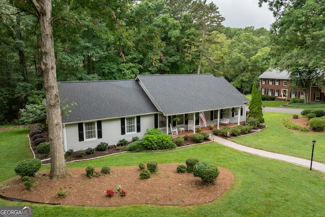 1505 Misty Valley Dr, Chatsworth, GA 30705 - view of front facade with covered porch, a front lawn, and a shingled roof