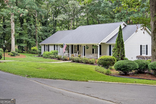 1505 Misty Valley Dr, Chatsworth, GA 30705 - view of front of property with covered porch, a front yard, and a shingled roof