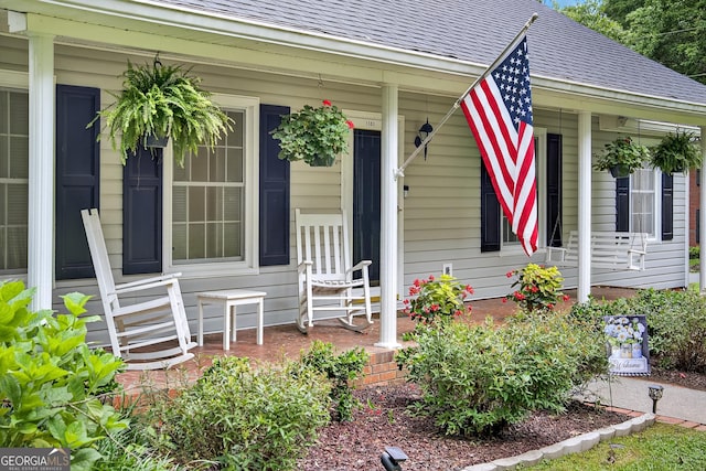 1505 Misty Valley Dr, Chatsworth, GA 30705 - doorway to property featuring covered porch and a shingled roof