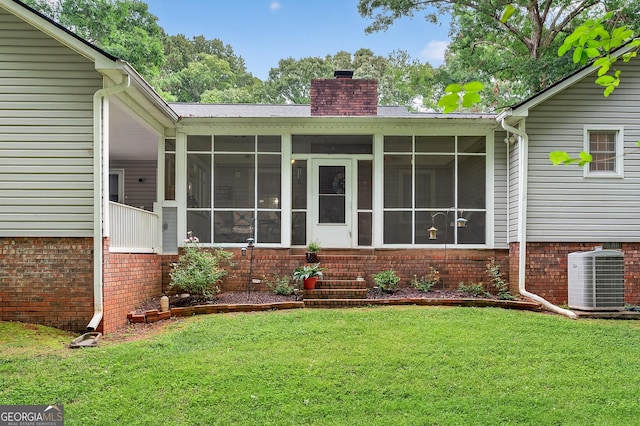 1505 Misty Valley Dr, Chatsworth, GA 30705 - back of house featuring a chimney, a sunroom, a lawn, and brick siding