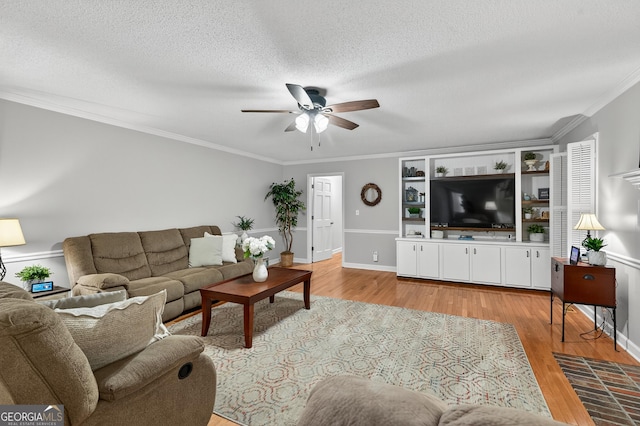 1505 Misty Valley Dr, Chatsworth, GA 30705 - living area with ceiling fan, light wood-style flooring, ornamental molding, and a textured ceiling