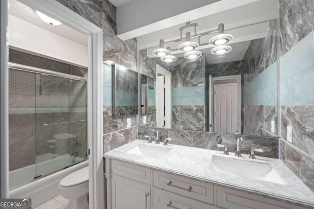 834 Lake Hollow Blvd SW, Marietta, GA 30064 - bathroom with double vanity and bath / shower combo with glass door