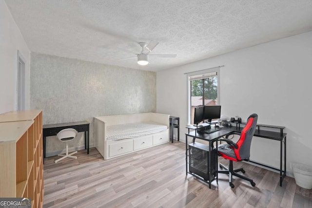 834 Lake Hollow Blvd SW, Marietta, GA 30064 - office area with wood finished floors, ceiling fan, and a textured ceiling